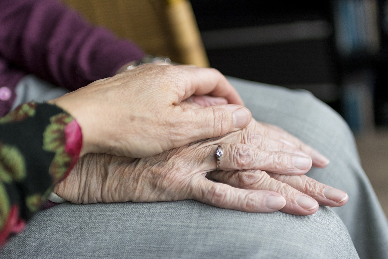 image of old man and woman hands