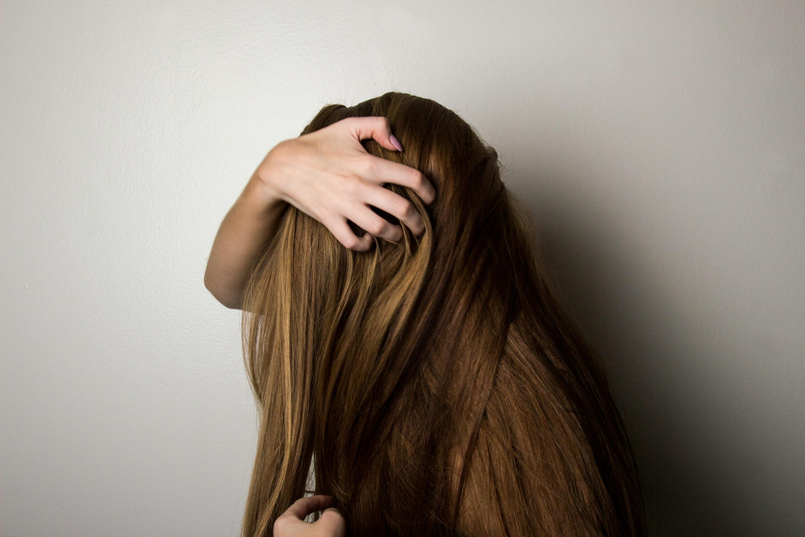 Woman Covering Face with Her Hair.