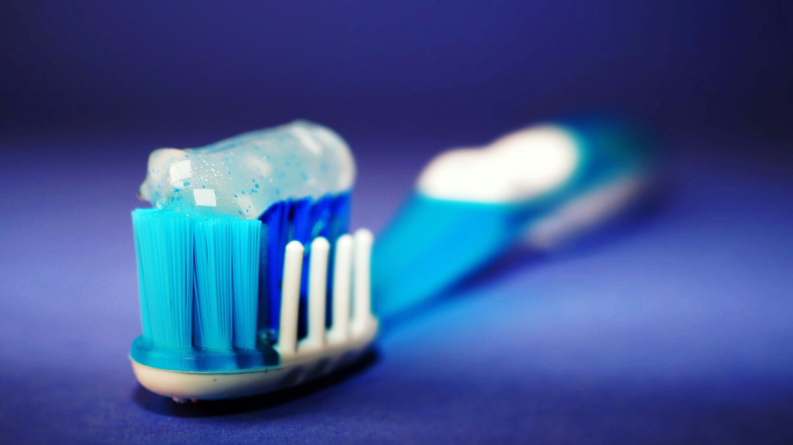 Focus Photography of Toothbrush With Toothpaste