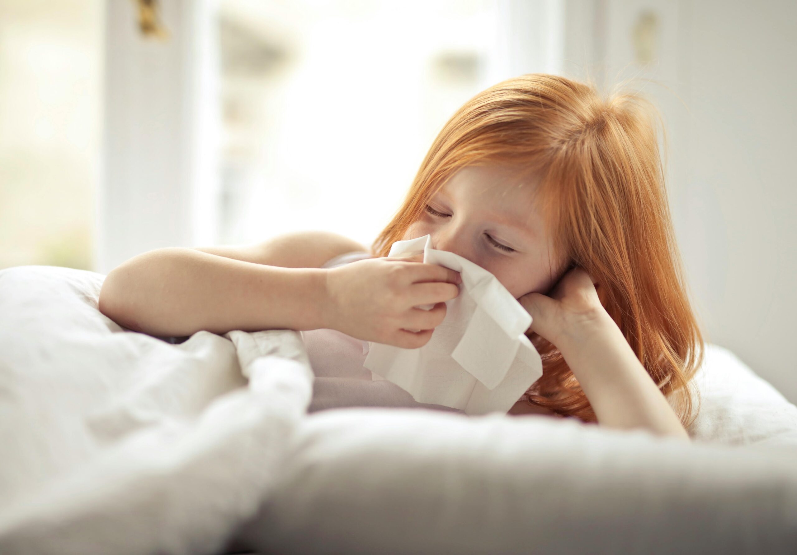 Girl Wiping Her Nose with Tissue